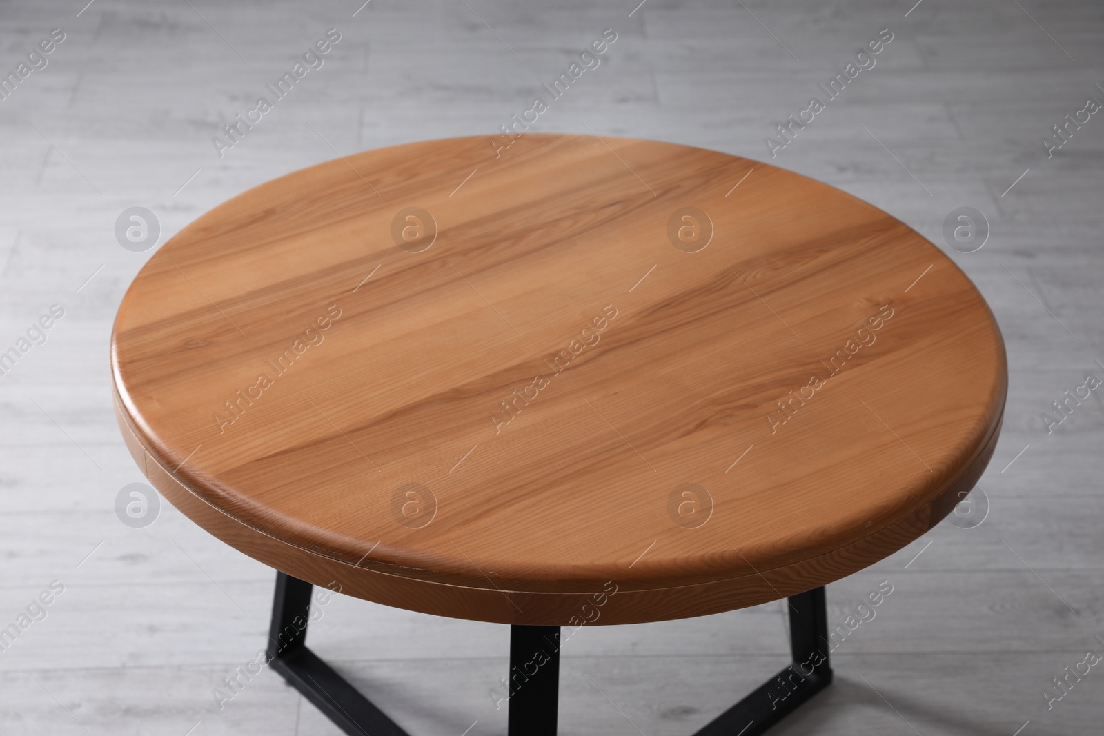 Photo of Empty wooden table indoors, closeup. Stylish furniture