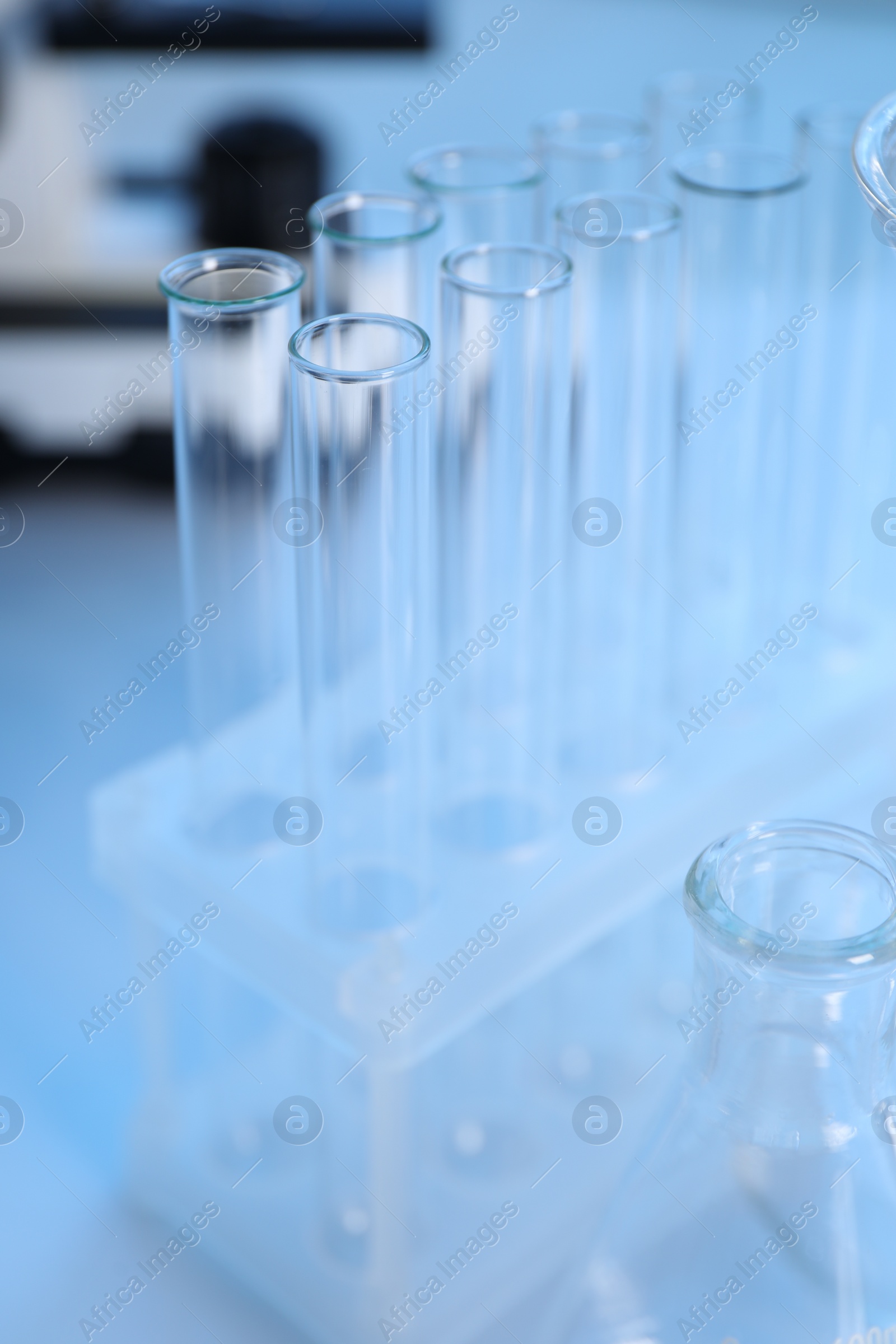 Photo of Laboratory analysis. Different glassware on white table, closeup