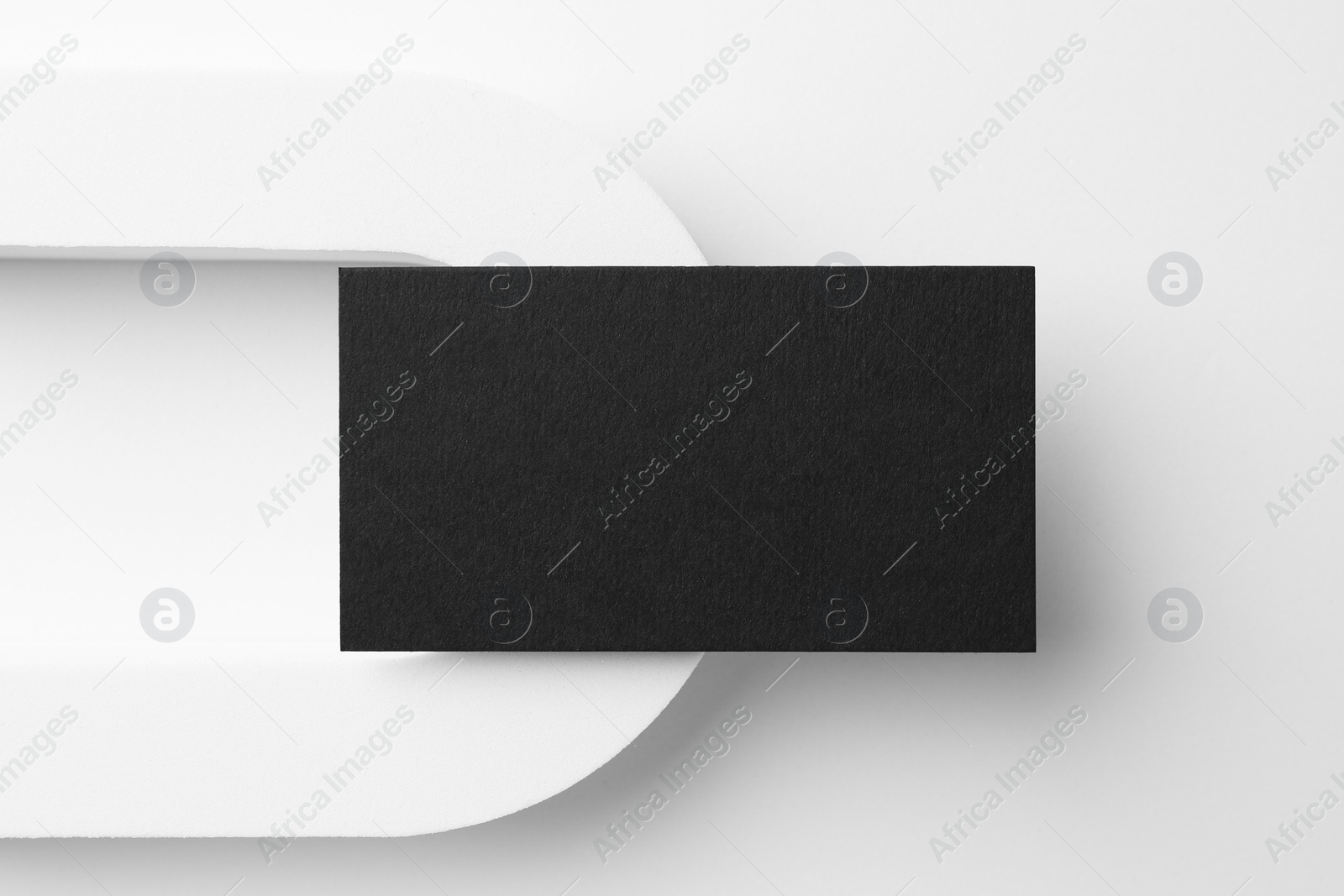 Photo of Blank black business card on white background, top view. Mockup for design