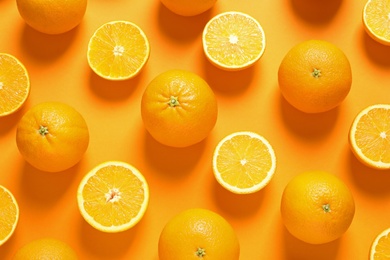 Photo of Flat lay composition with ripe oranges on color background