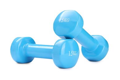 Light blue dumbbells isolated on white. Sports equipment