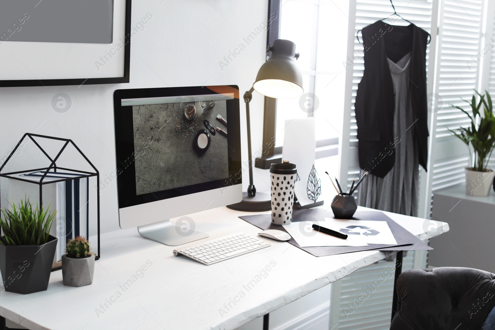 Photo of Stylish workplace with modern computer on desk