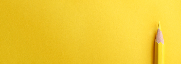 Color pencil on yellow background, top view with space for text. Banner design
