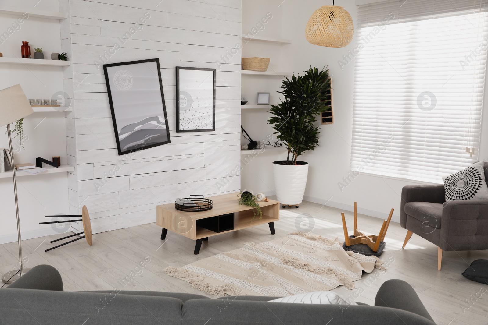 Photo of Chaotic living room interior after strong earthquake