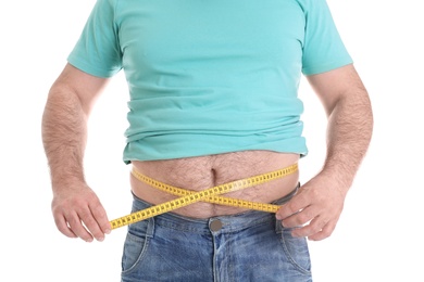 Photo of Overweight man with large belly and measuring tape isolated on white, closeup