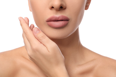 Woman with pink lipstick on white background, closeup