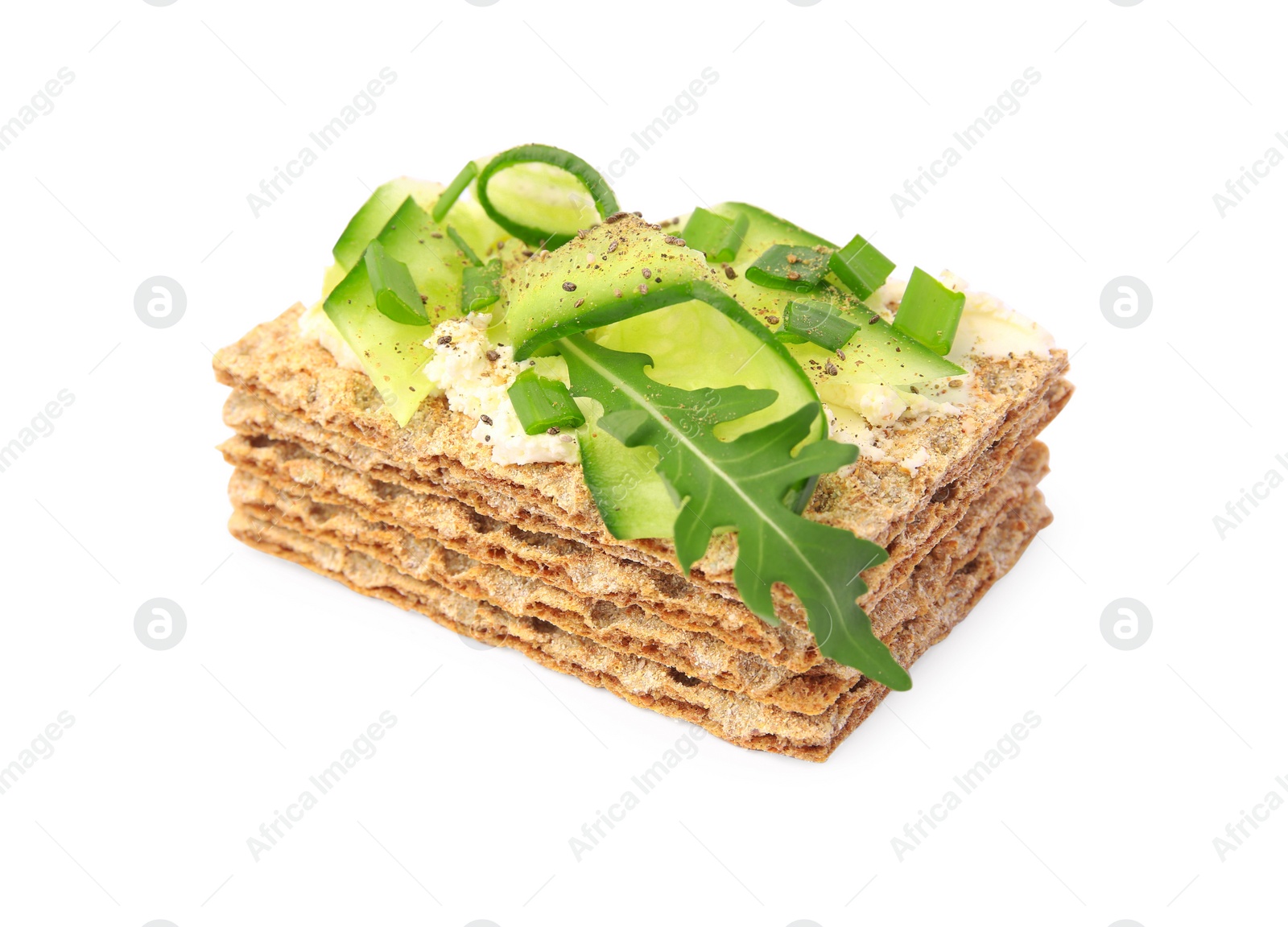 Photo of Fresh crunchy crispbreads with cream cheese, cucumber, green onion and arugula isolated on white