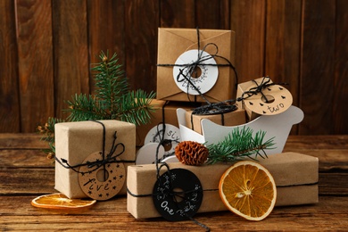 Photo of Gifts for Christmas advent calendar and festive decor on wooden table