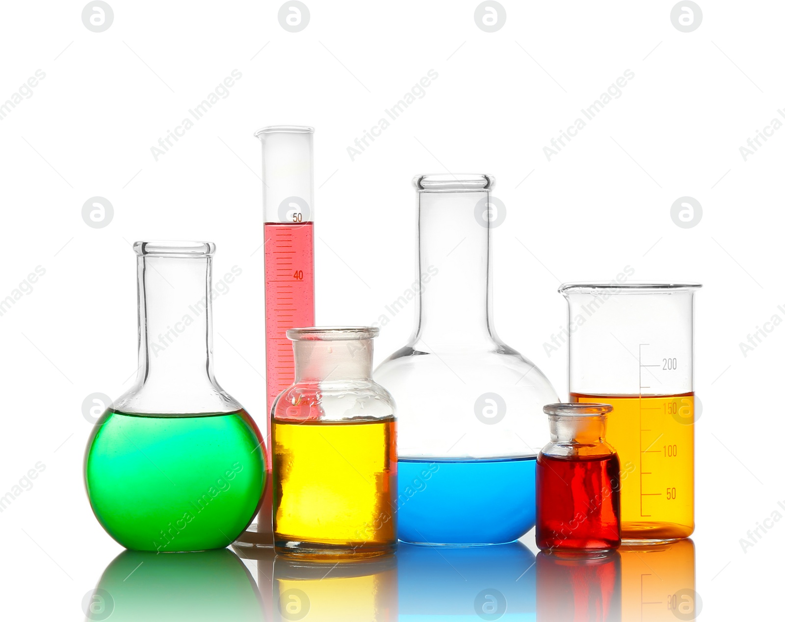 Photo of Different laboratory glassware with colorful liquids isolated on white
