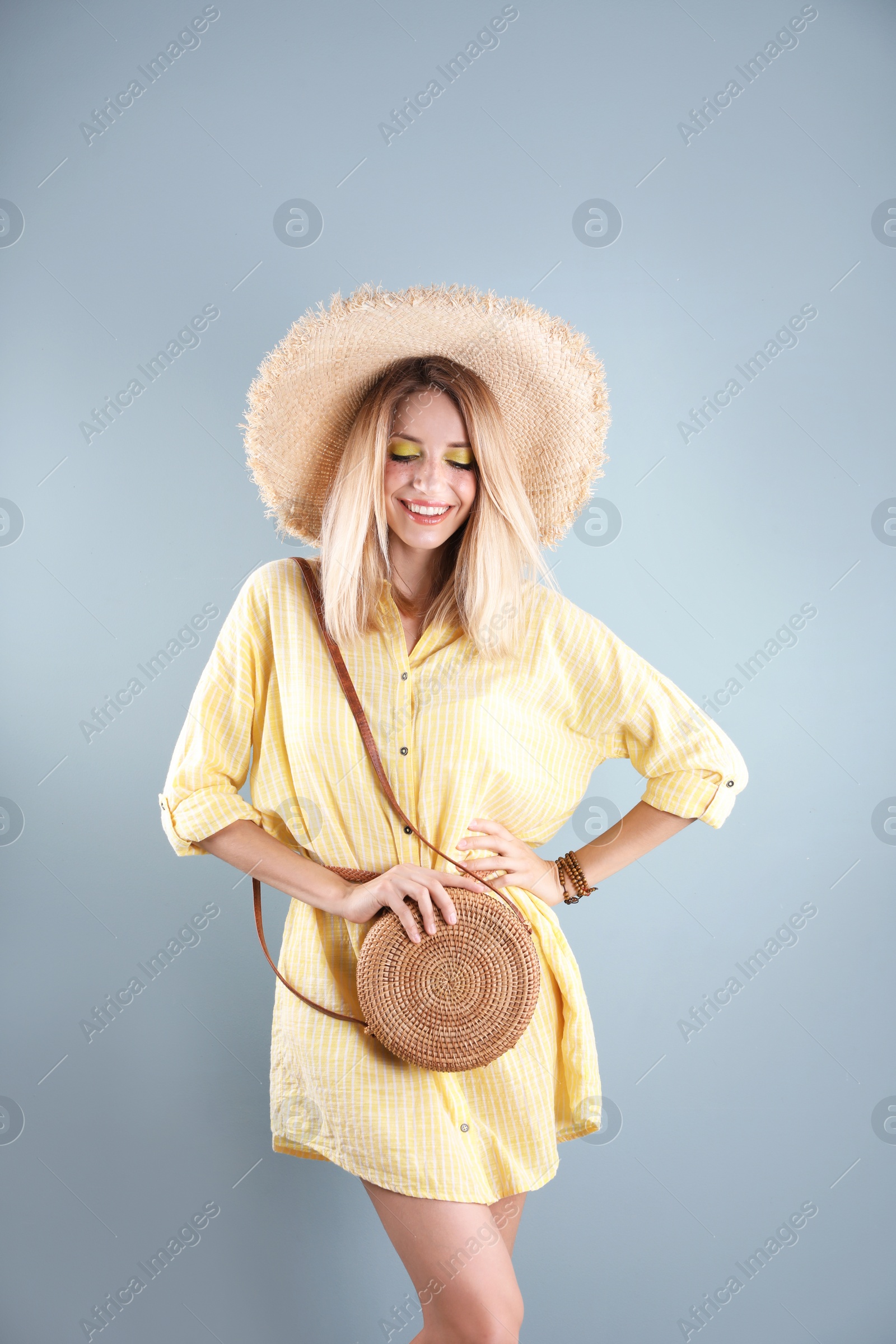 Photo of Beautiful young woman posing on color background. Summer fashion