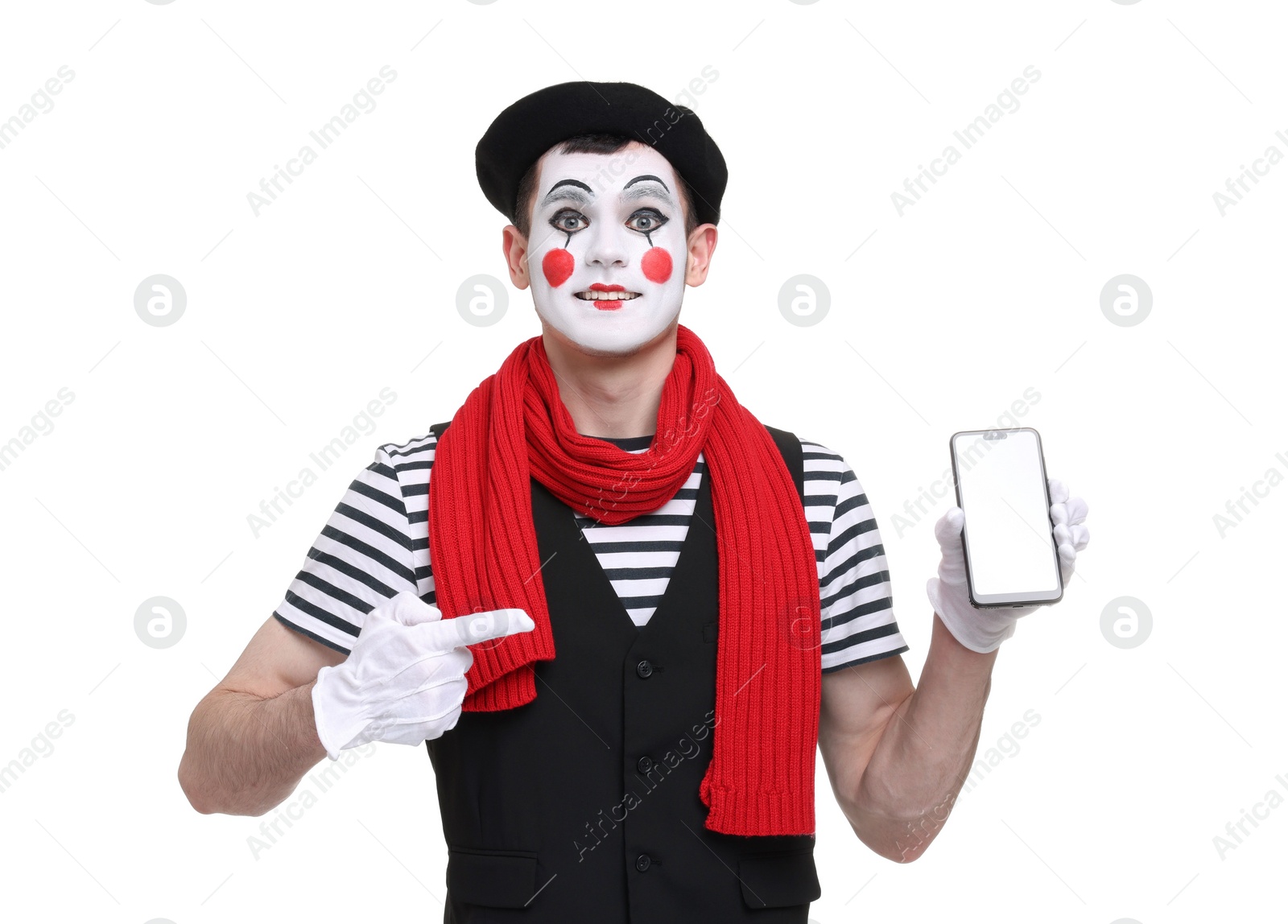 Photo of Funny mime artist pointing at smartphone on white background