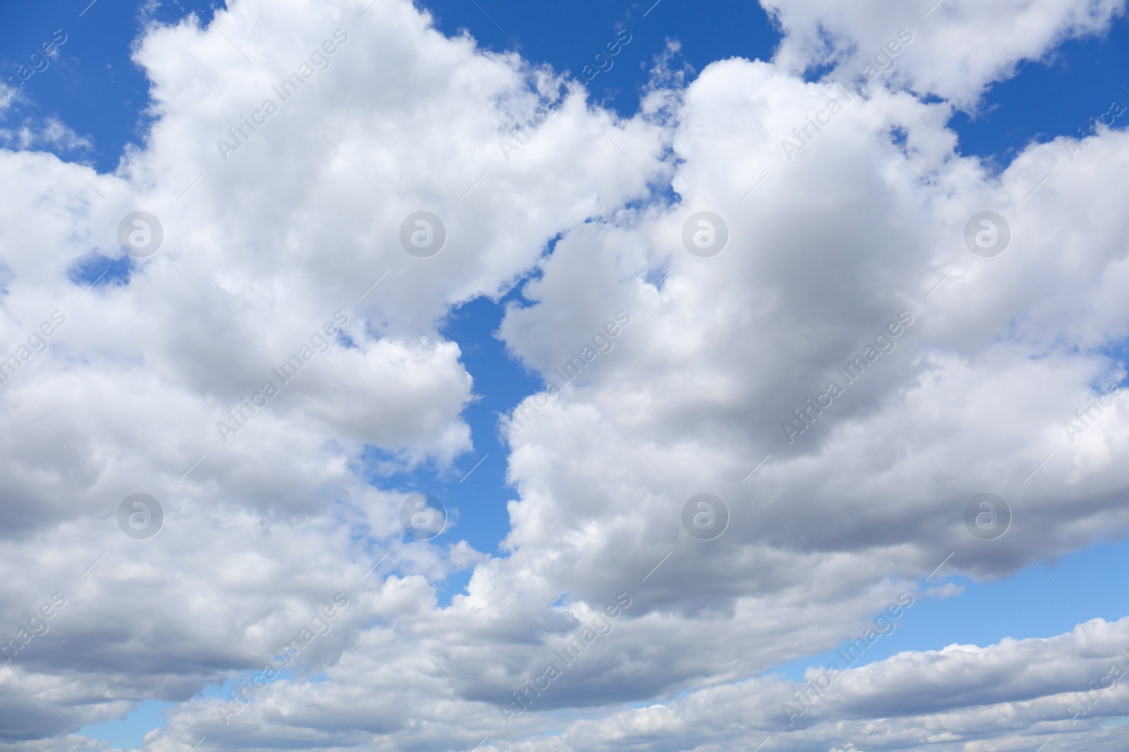 Photo of Picturesque view of beautiful fluffy clouds in light blue sky