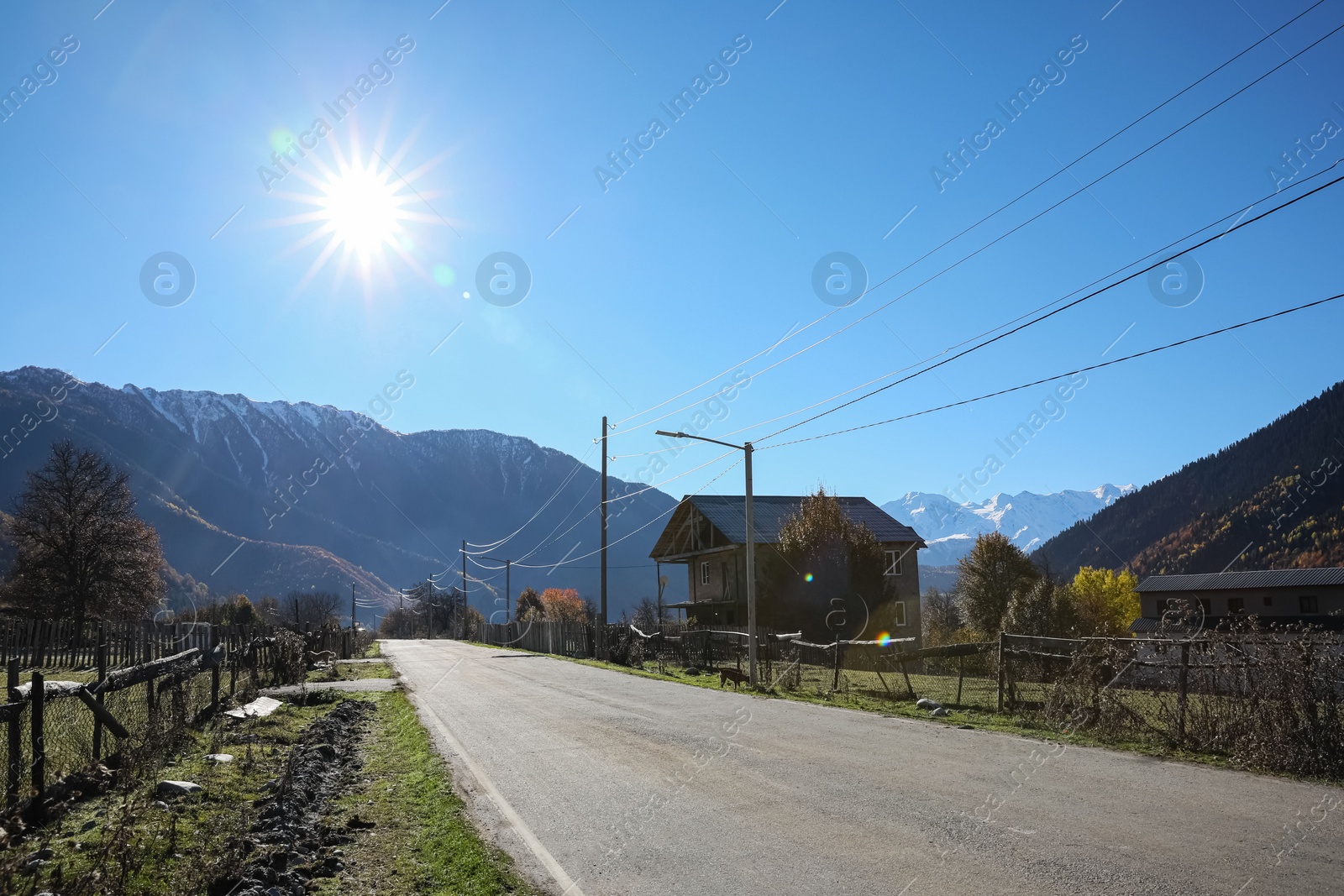 Photo of View of empty asphalt highway in mountains on sunny day. Road trip