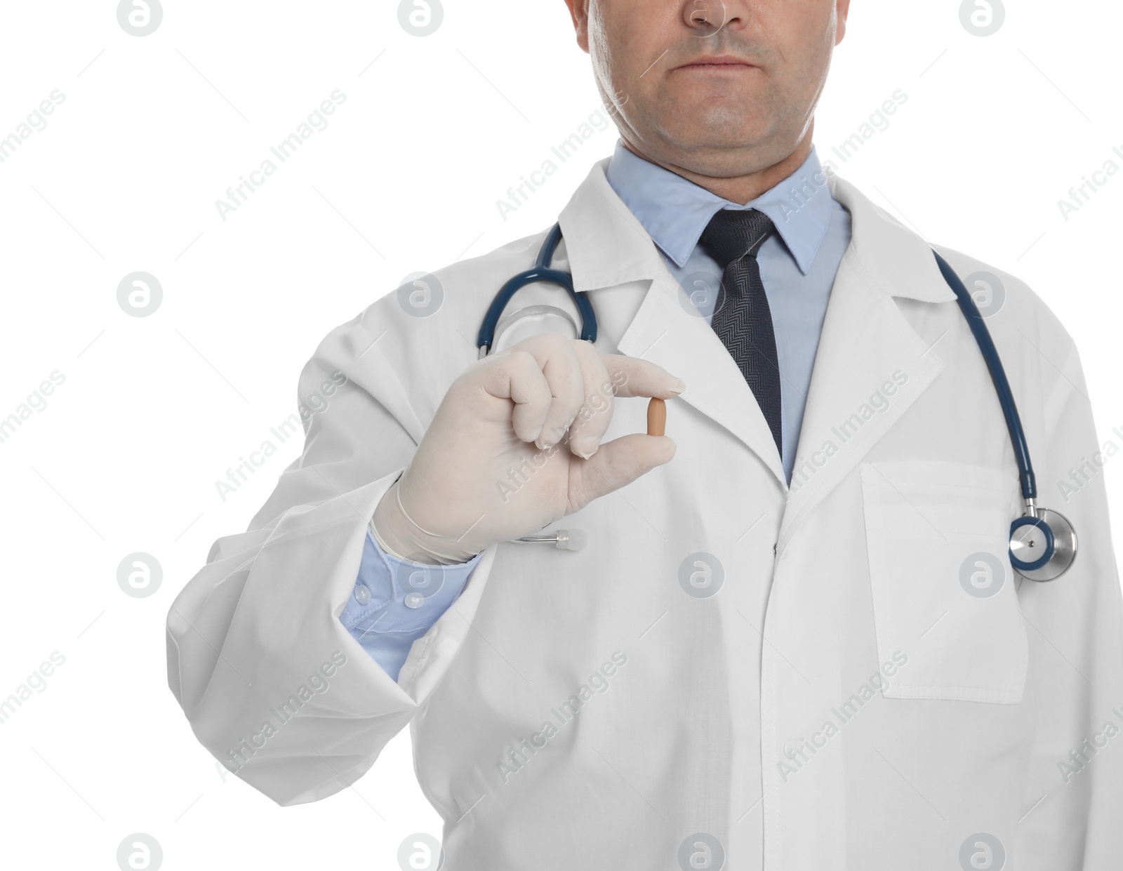 Photo of Doctor holding suppository for hemorrhoid treatment on white background, closeup