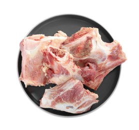 Photo of Plate with raw chopped meaty bones isolated on white, top view