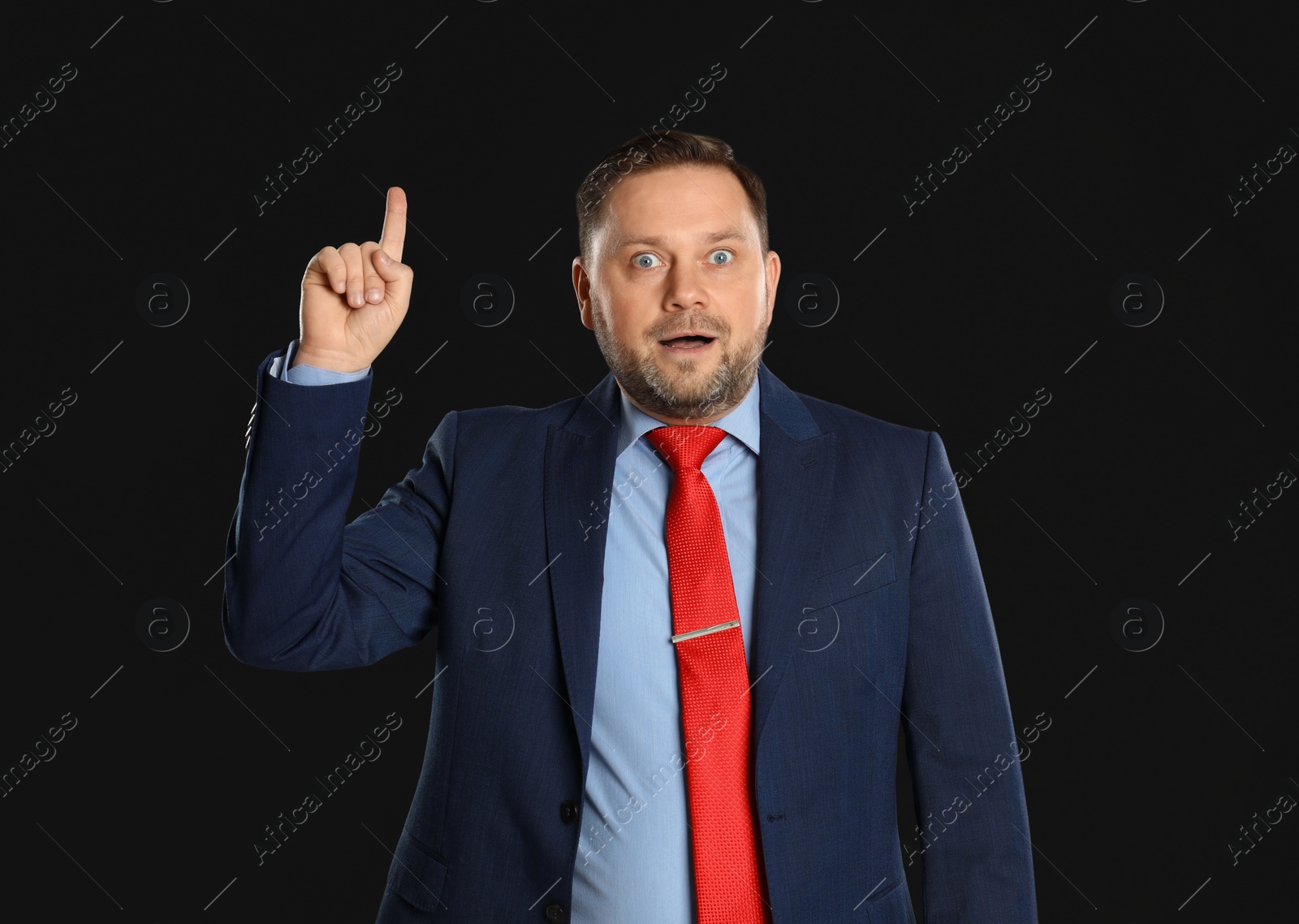 Photo of Portrait of emotional mature man on black background