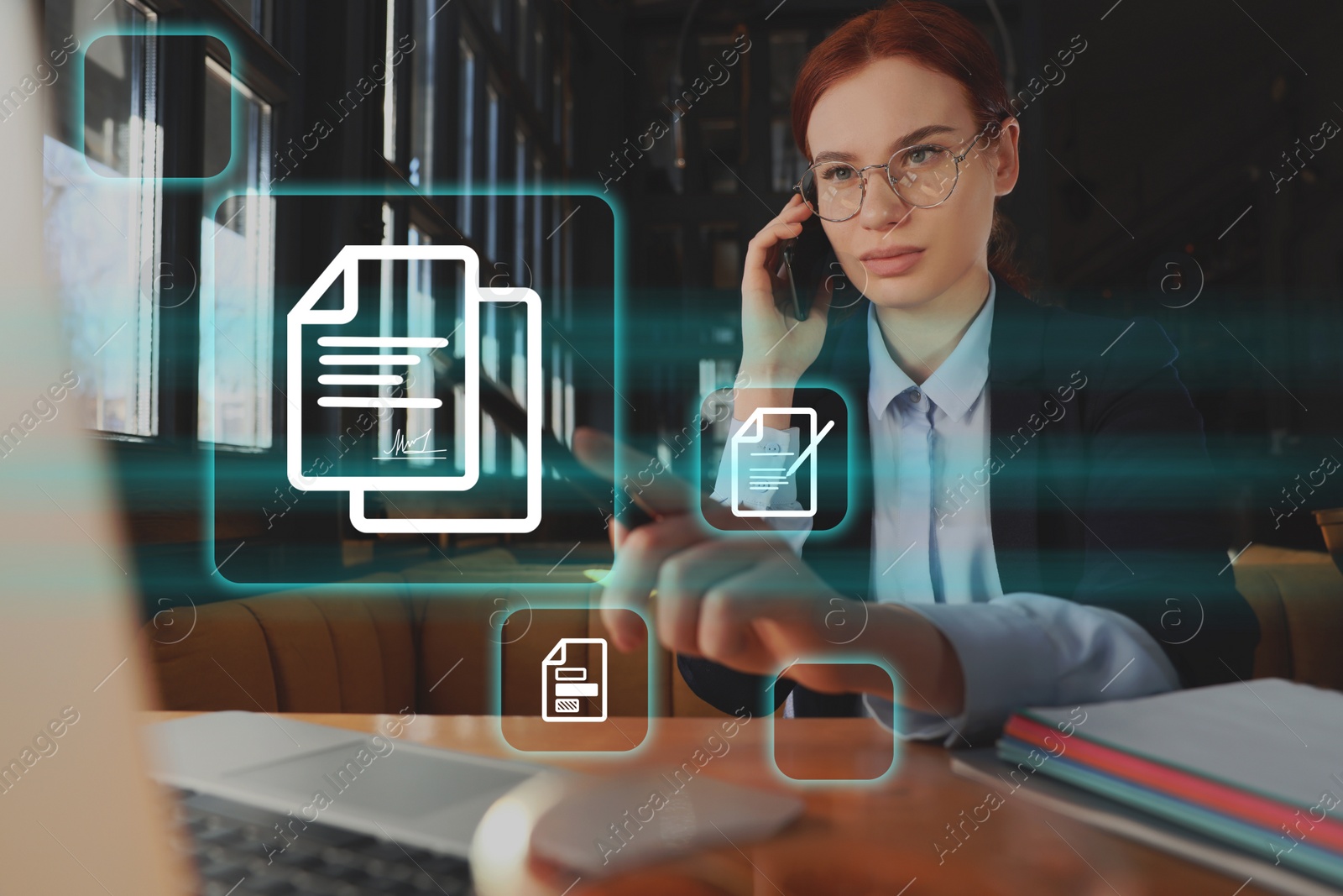 Image of Concept of electronic signature. Young woman with laptop talking on phone at table in cafe