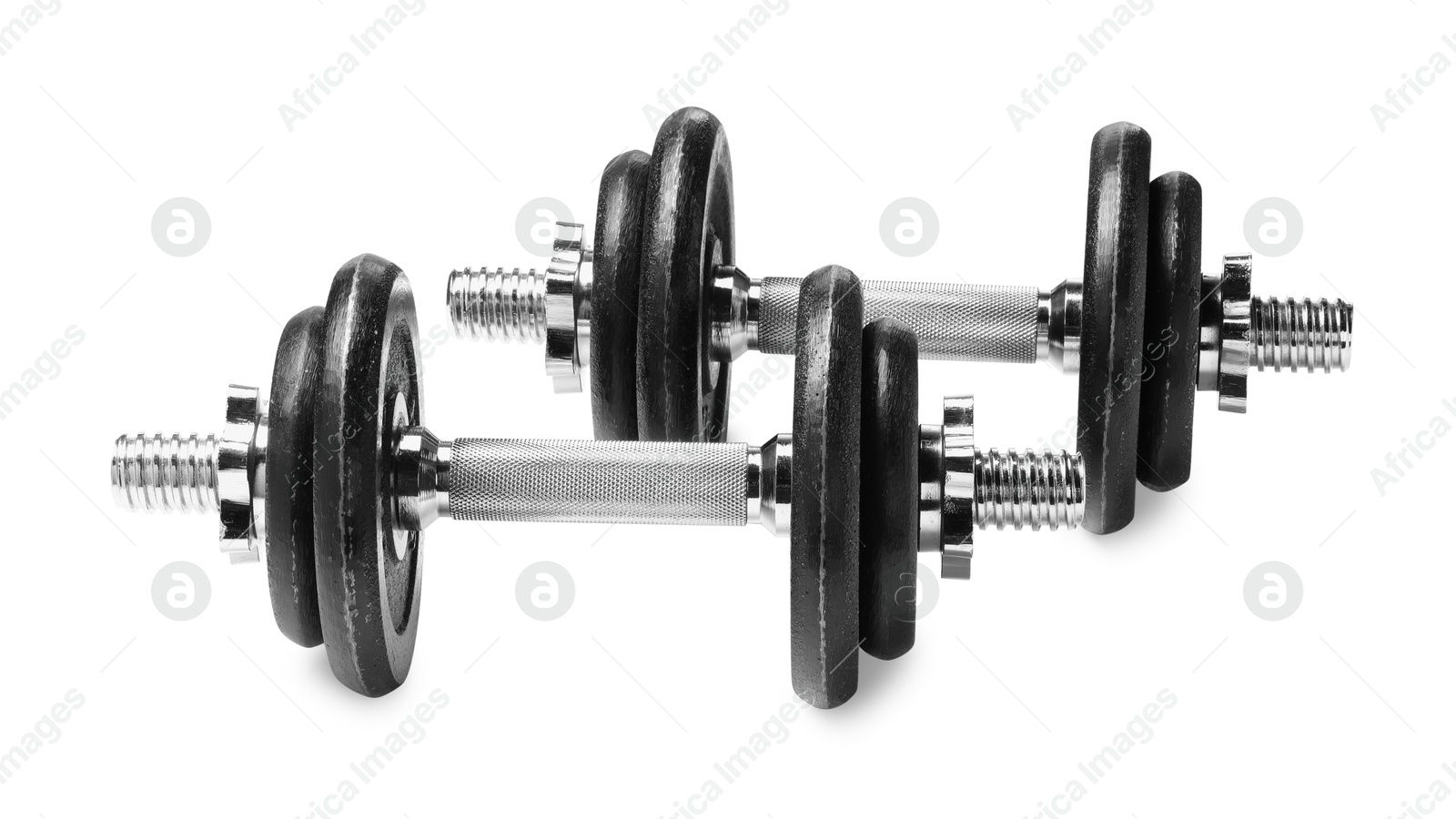 Photo of Metal dumbbells isolated on white. Sports equipment