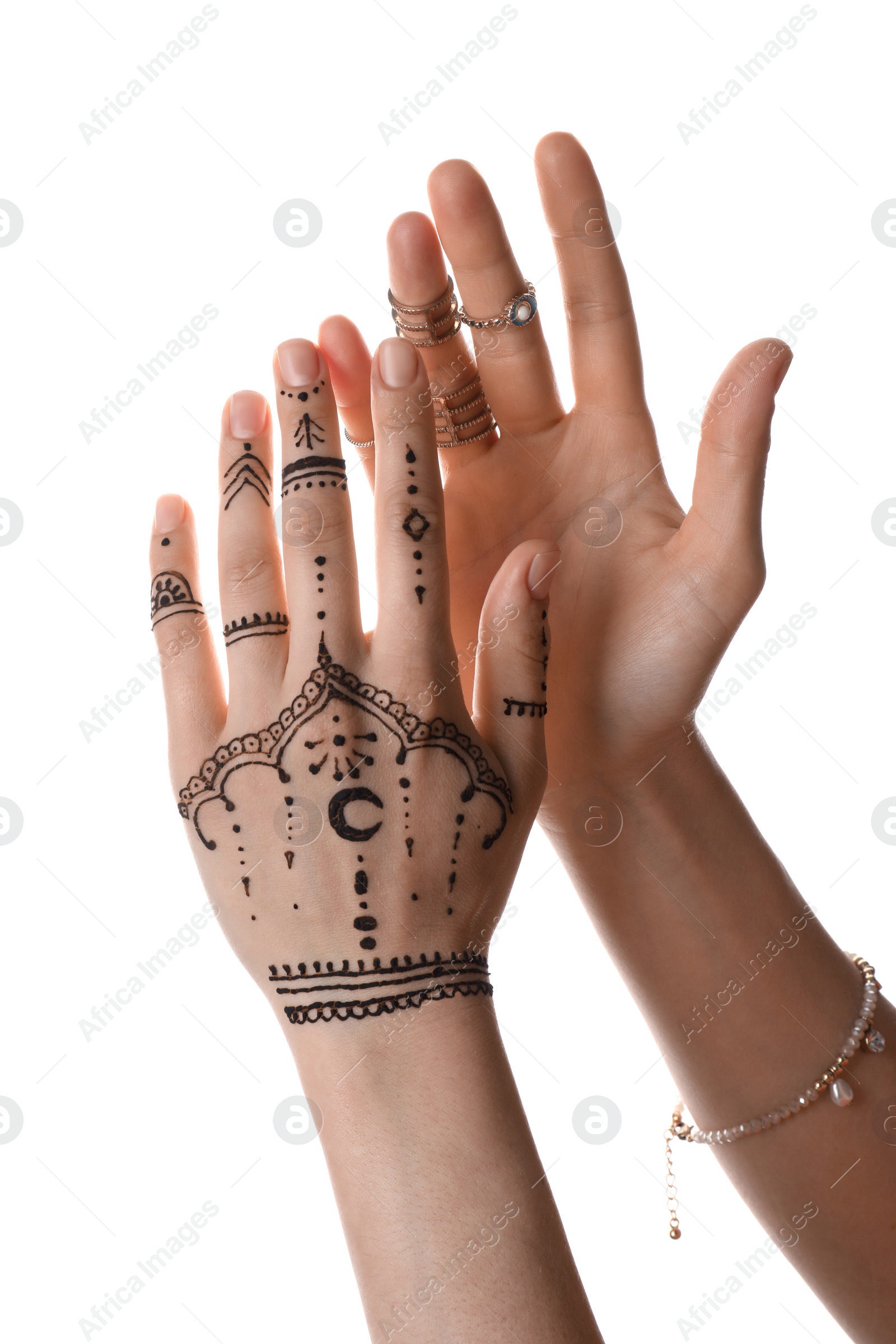 Photo of Woman with henna tattoo on hand against white background, closeup. Traditional mehndi ornament