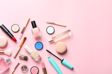 Flat lay composition with decorative cosmetics on color background