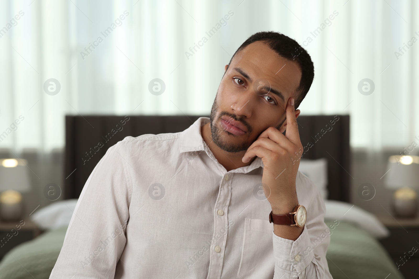 Photo of Bored man having online video call at home, view from camera