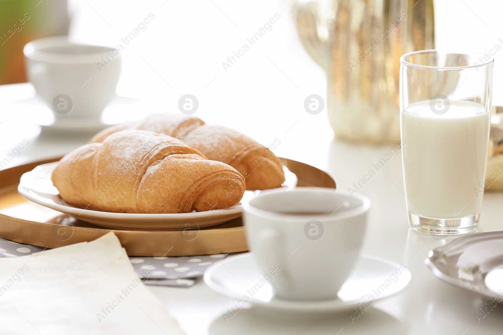 Photo of Tasty breakfast with fresh croissants on table