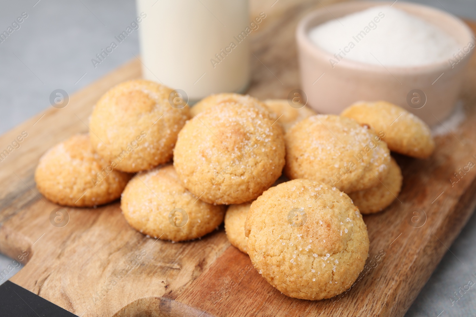 Photo of Tasty fresh sugar cookies on grey table, closeup