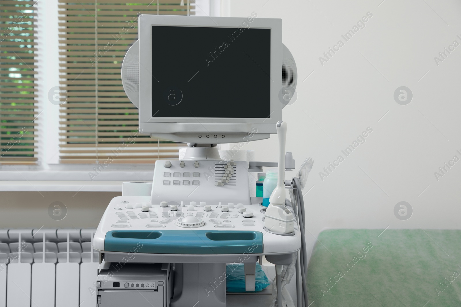Photo of One ultrasound machine near window in hospital