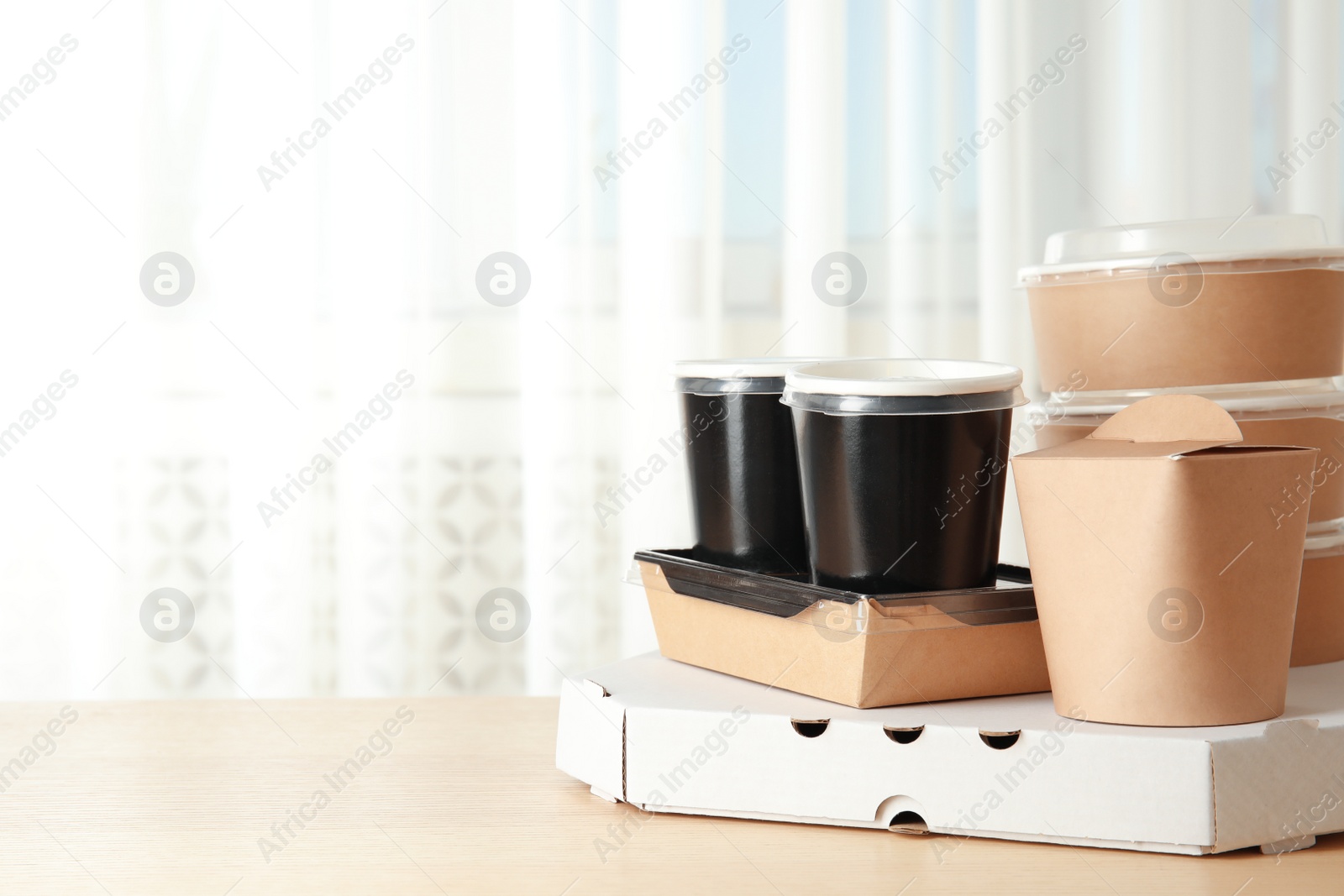 Photo of Various takeout containers on table, space for text. Food delivery service