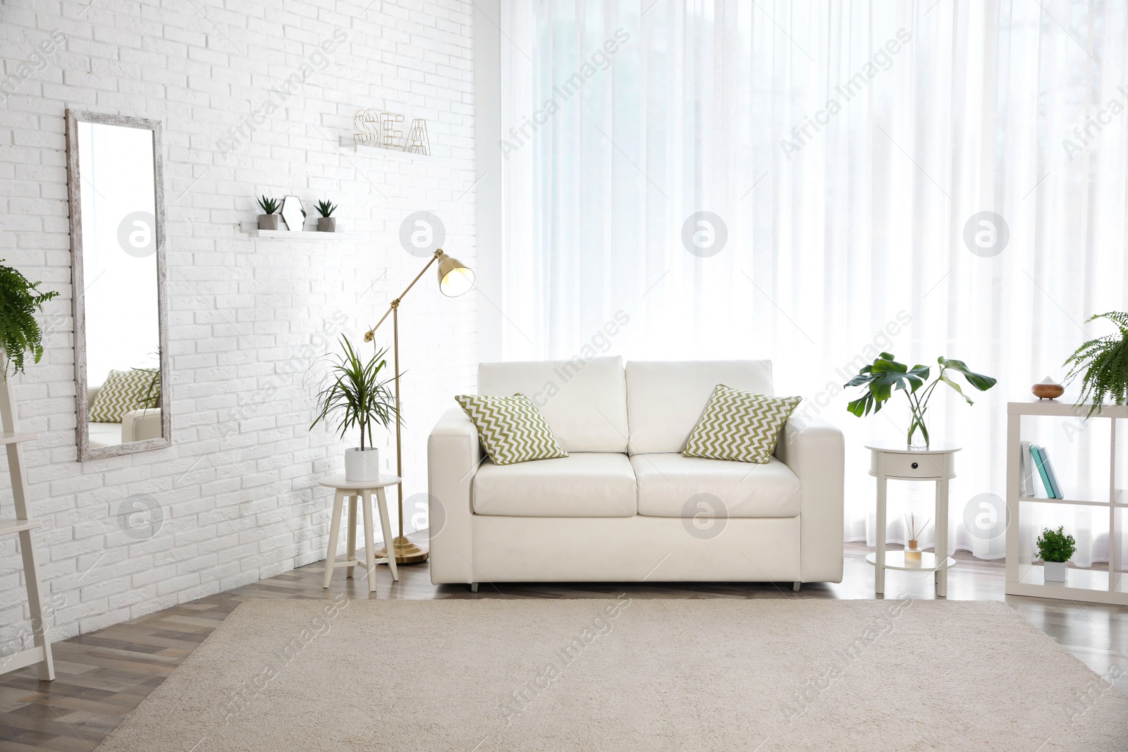 Photo of Stylish room interior with green home plants