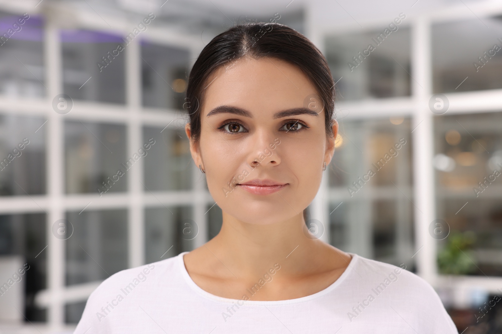 Photo of Portrait of beautiful young woman on blurred background