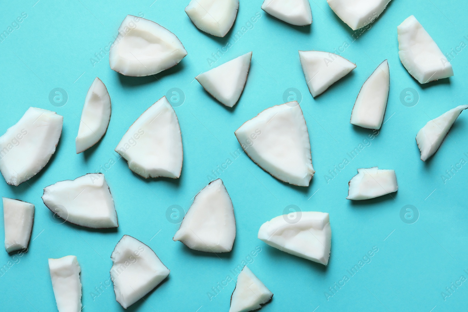 Photo of Coconut pieces on color background