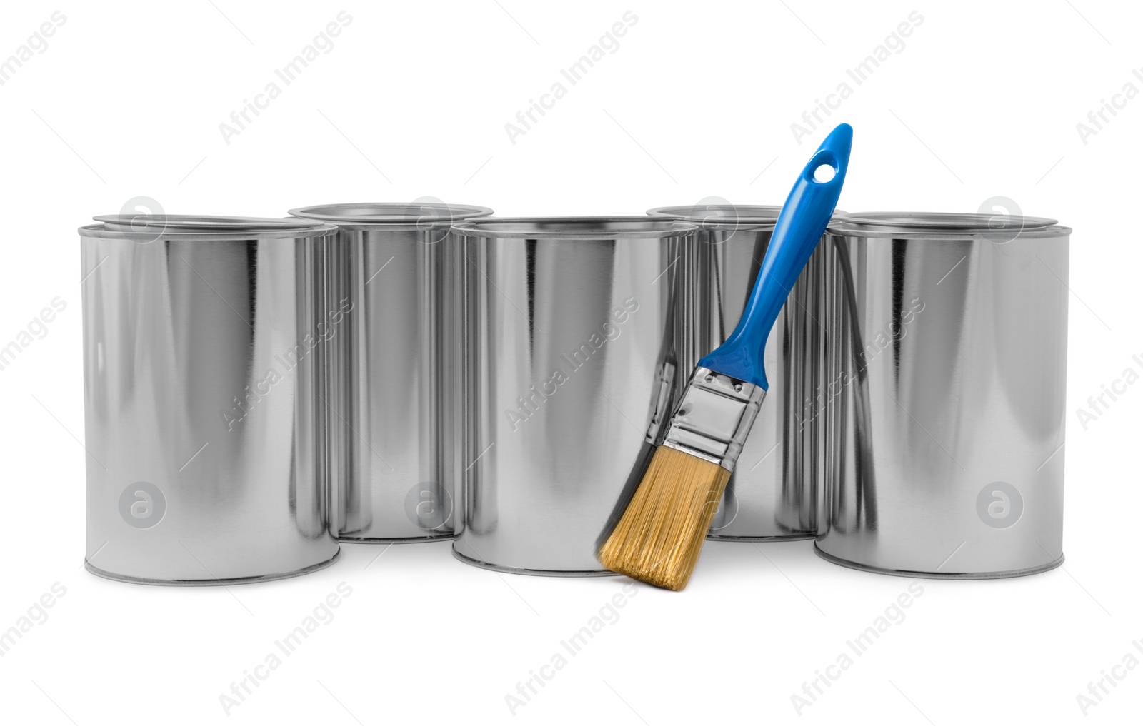 Photo of Cans of paints and brush on white background