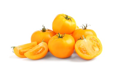 Photo of Cut and whole yellow tomatoes on white background