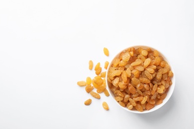 Bowl with raisins and space for text on white background, top view. Dried fruit as healthy snack