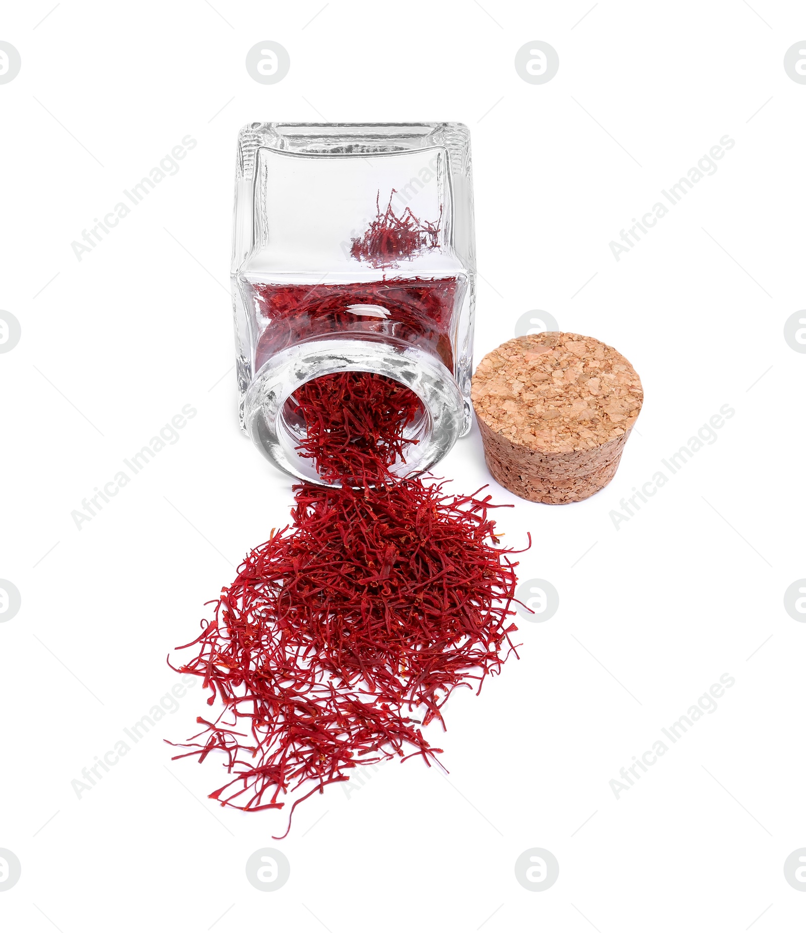 Photo of Aromatic saffron and glass jar isolated on white