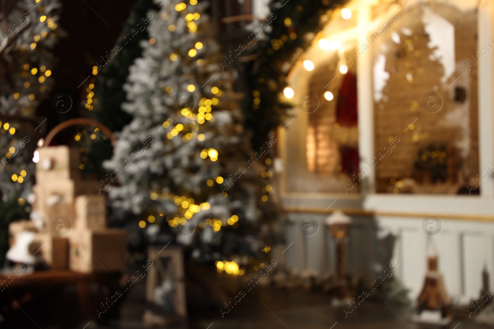 Photo of Blurred view of stylish room interior with Christmas tree and festive decor