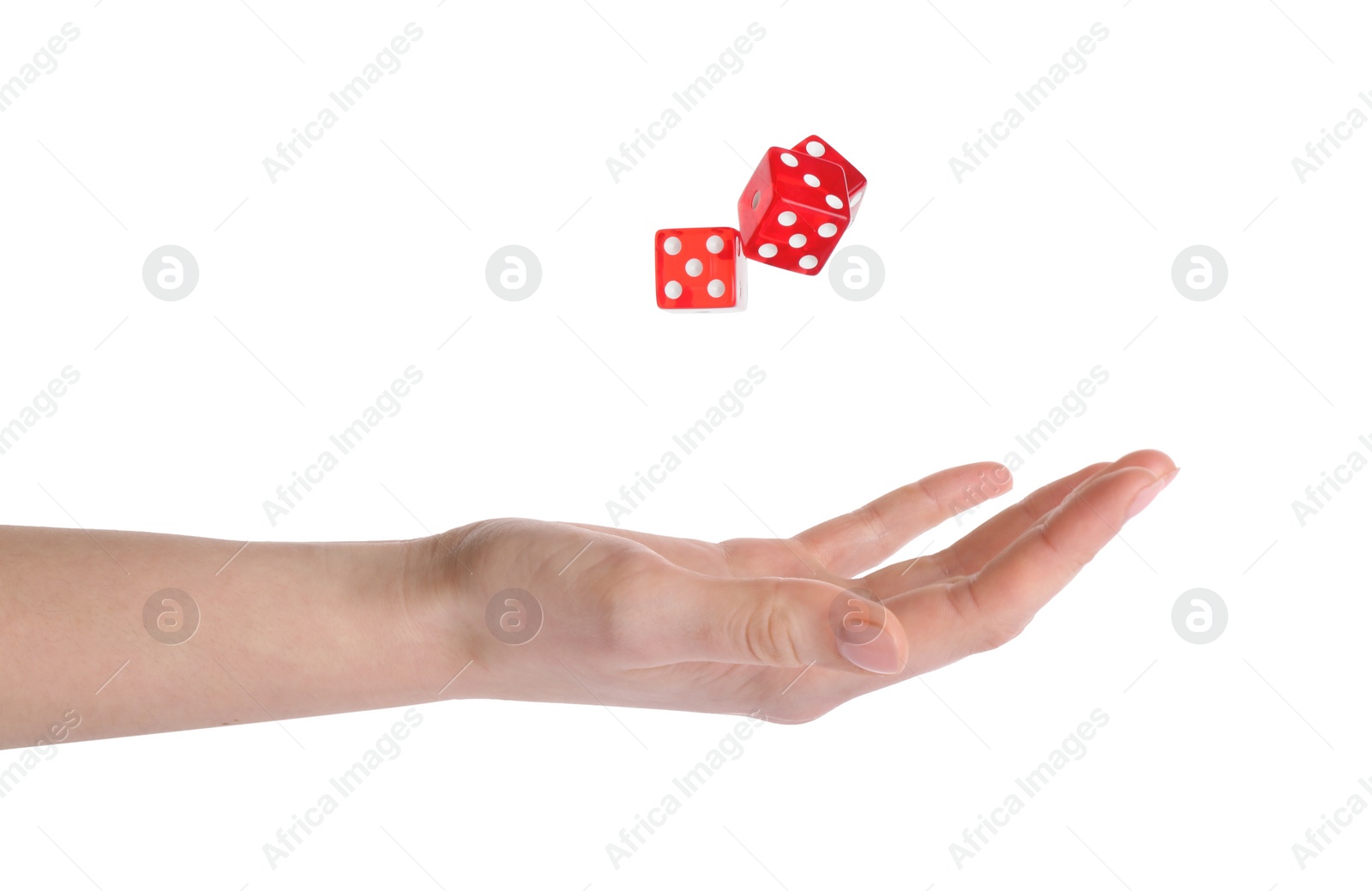 Photo of Woman throwing game dices on white background, closeup