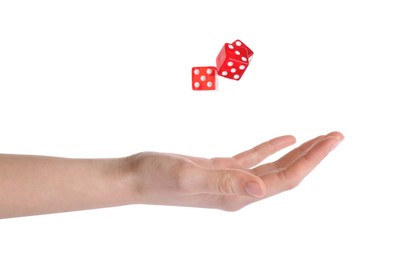 Woman throwing game dices on white background, closeup