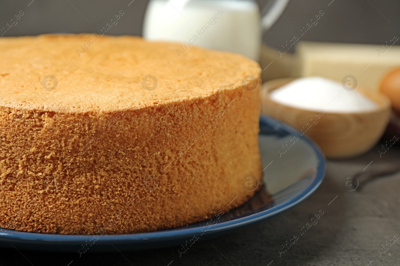 Photo of Delicious fresh homemade cake on grey marble table, closeup