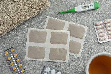 Flat lay composition with mustard plasters on light grey table