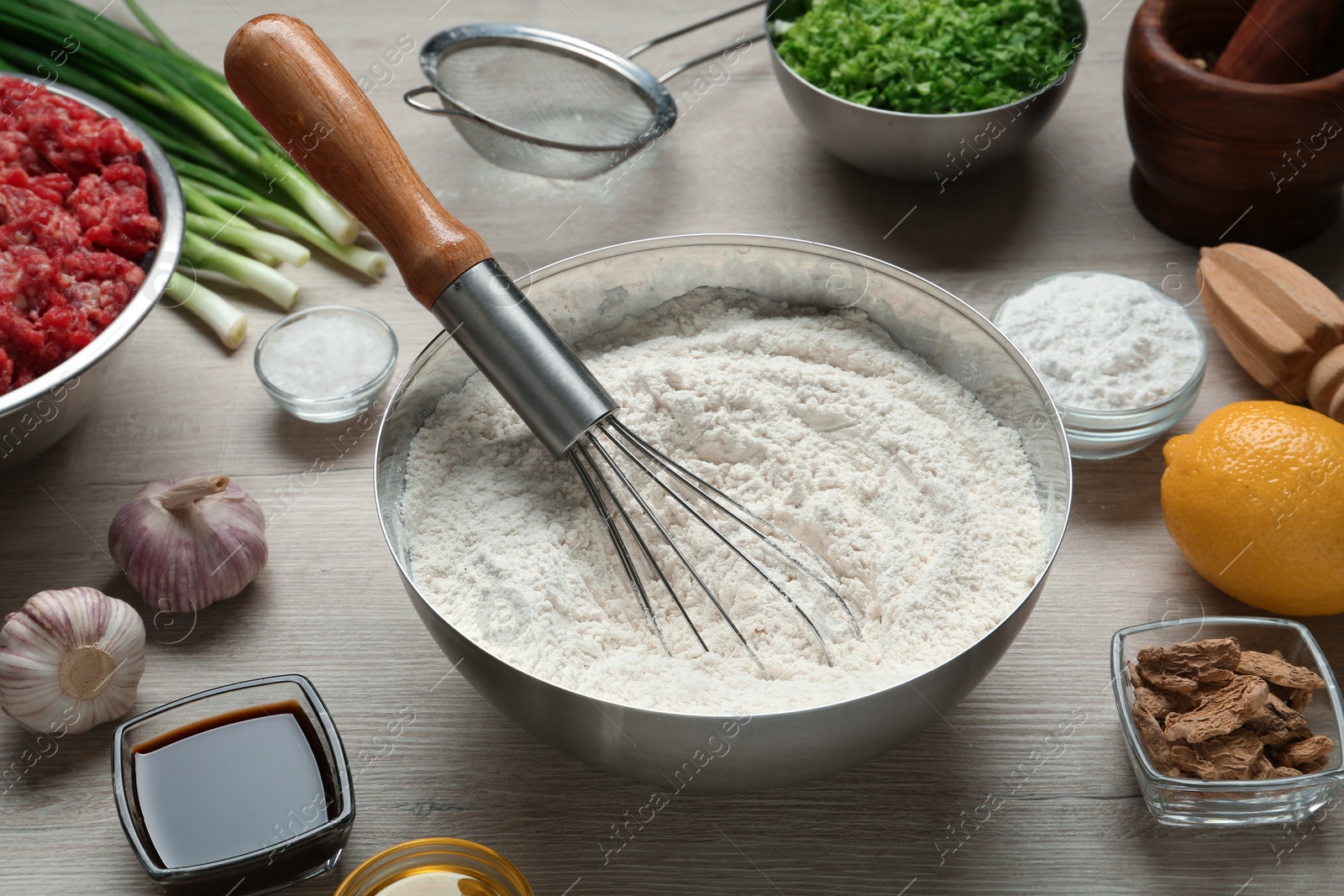 Photo of Composition with ingredients for gyoza on white wooden table