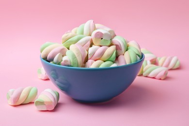 Photo of Bowl with delicious colorful marshmallows on pink background, closeup