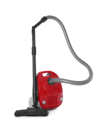 Modern red vacuum cleaner isolated on white