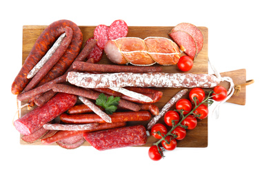 Wooden board with different tasty sausages isolated on white, top view