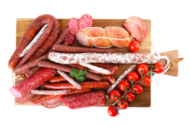 Photo of Wooden board with different tasty sausages isolated on white, top view