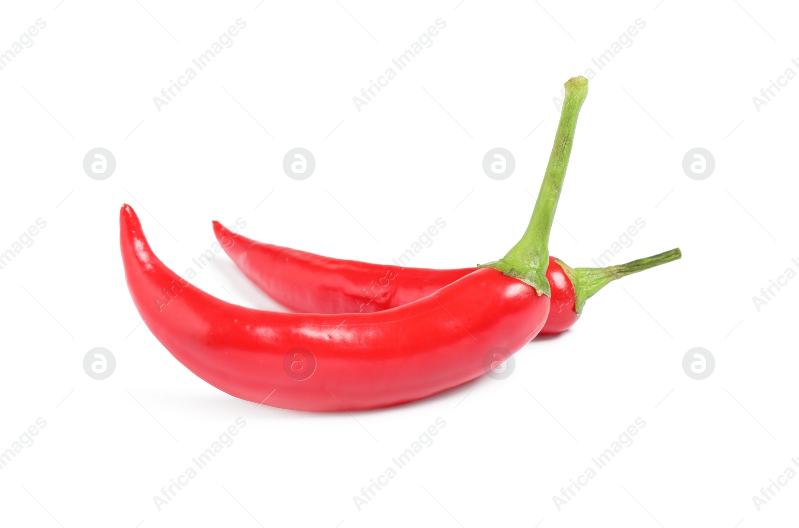 Photo of Ripe red hot chili peppers isolated on white