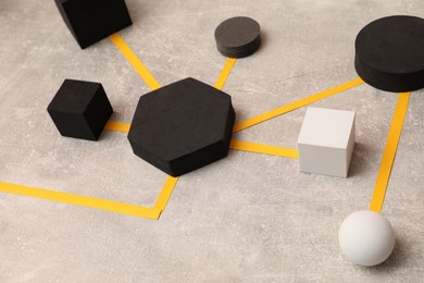 Business process organization and optimization. Scheme with geometric figures on light grey table