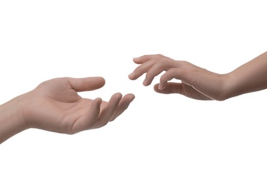 Photo of Man and woman reaching to each other on white background, closeup of hands