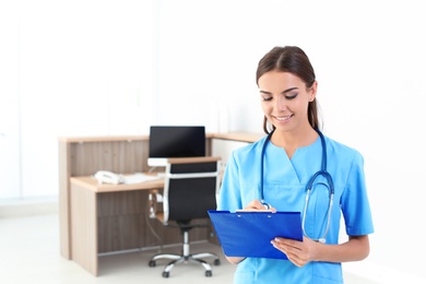 Photo of Female medical assistant in clinic. Health care service